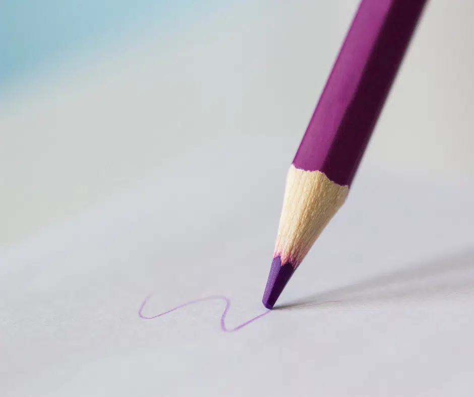 Purple colored pencil writing on paper